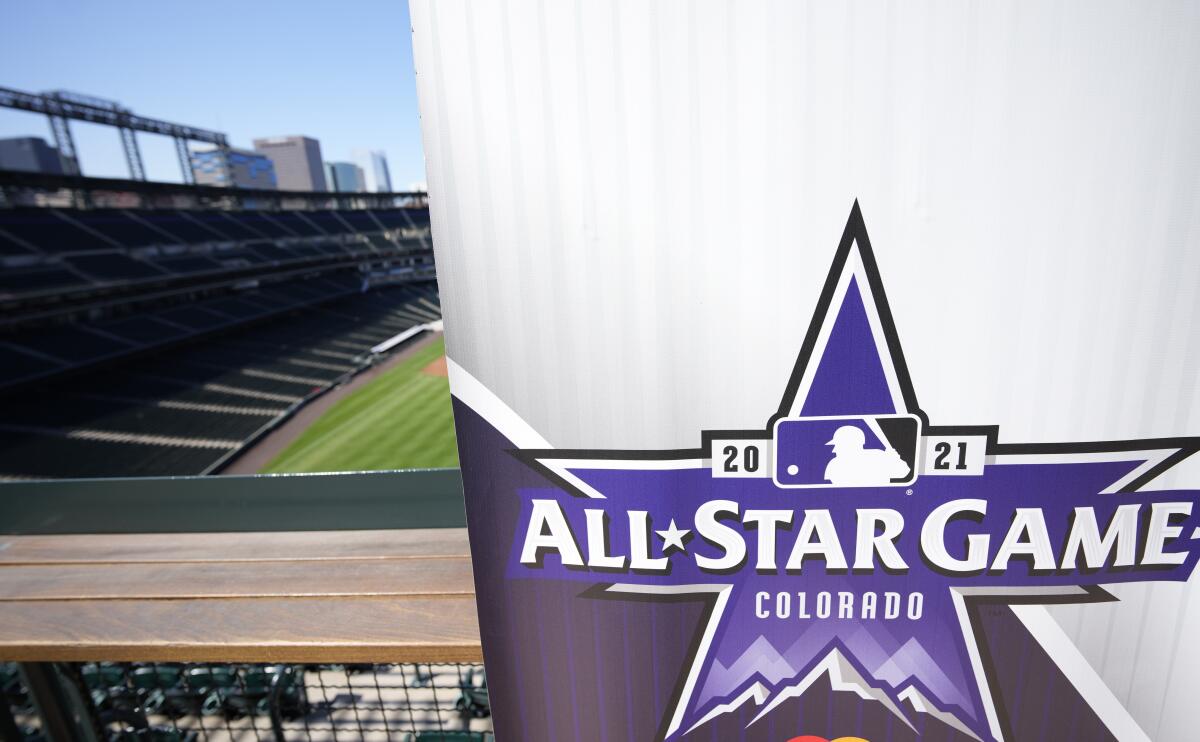 A sign bearing the 2021 MLB All-Star Game logo stands in the upper deck at Coors Field.