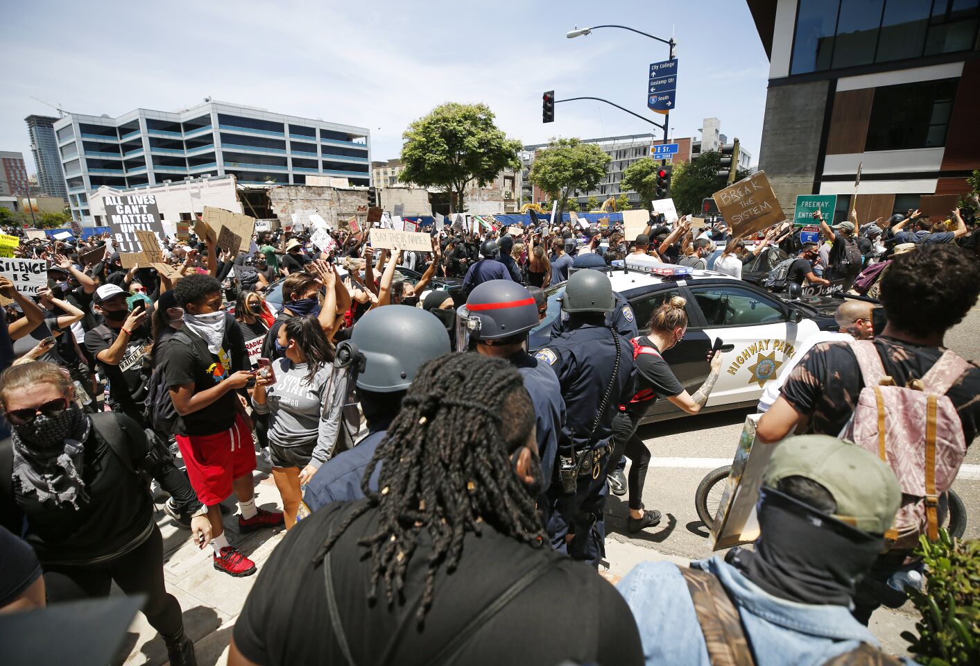 San Diego police and CHP tried to stop a group protesting the death of George Floyd from getting on I-5 in downtown San Diego on May 31, 2020. The protesters made it onto the freeway.