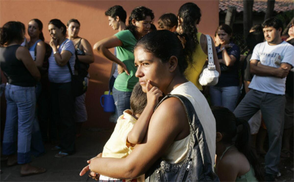 PEOPLE ARE DESPERATE: Residents of Luque, Paraguay, stand in line to be vaccinated against yellow fever. Thirteen cases have been reported, including three deaths. An outbreak of the disease has also occurred in neighboring Brazil.