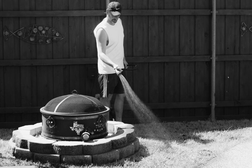 DALLAS, TX - Julien Bontron waters the lawn in his yard in McKinney, a suburb of Dallas. New college graduates, young working parents, mid-career professionals and Elon Musk are among the big wave of Californians who have moved to Texas in the last three years. Reasons are myriad. Job loss, cost of living, and taxes are a few of the tick marks you see on surveys, according to the Associated Press. (Hunter Lacey / For The Times)