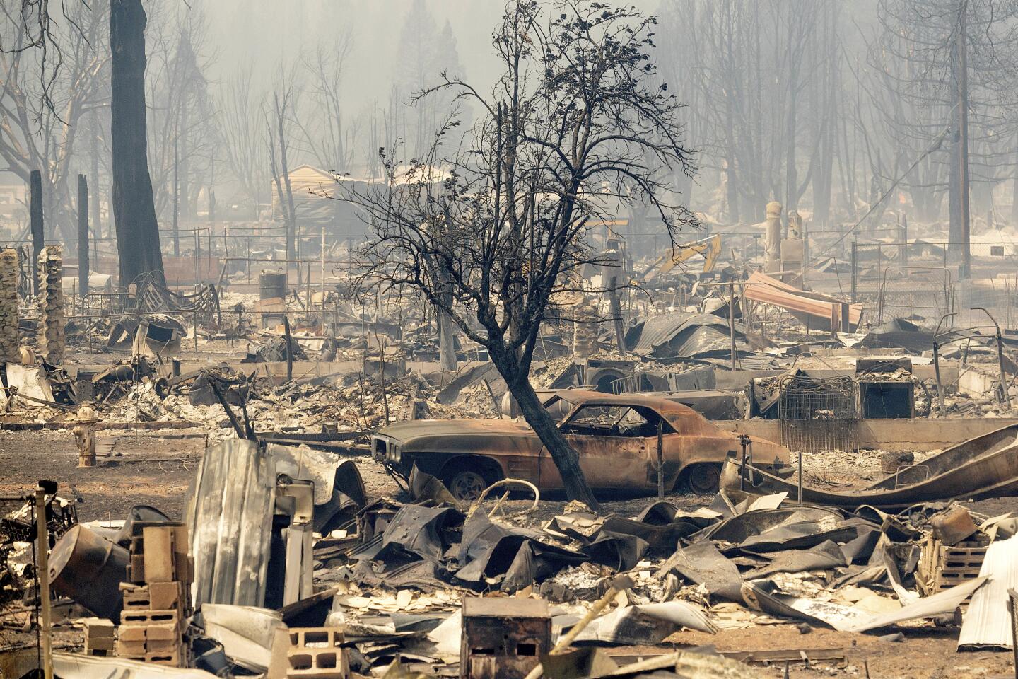 Homes and cars destroyed by the Dixie Fire line central Greenville on Aug. 5, 2021.