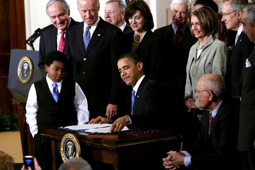 FILE - In this March 23, 2010, file photo, President Barack Obama reaches for a pen to sign the health care bill in the East Room of the White House in Washington. Several million American workers will cut back their hours on the job or leave the nation's workforce entirely because of Obama's health care overhaul, congressional analysts said Tuesday, Feb. 4, 2014, adding fresh fuel to the political fight over "Obamacare." (AP Photo/Charles Dharapak, File) ***** Obamacare deadline for 2016 is Sunday; penalty is higher (01/28/16) ***** Help available for uninsured citizens (02/08/16) *****