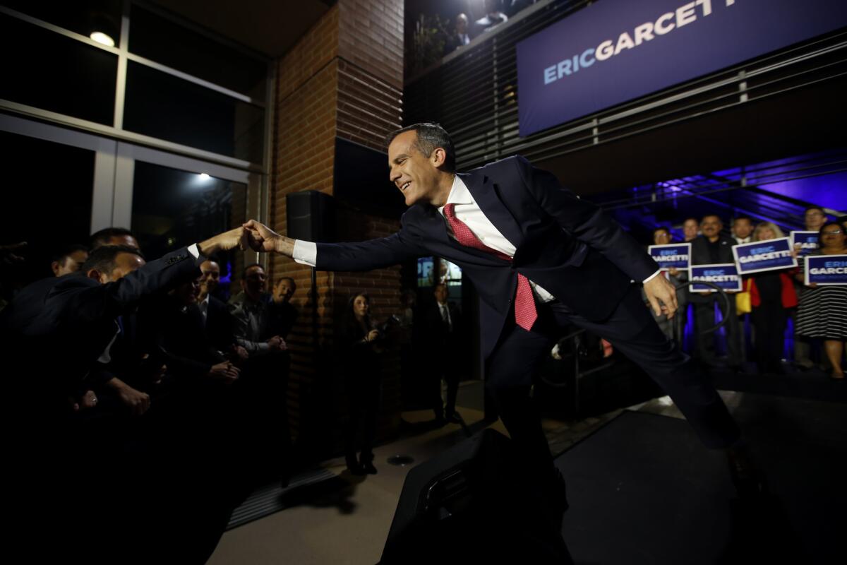 Los Angeles Mayor Eric Garcetti greets the crowd during an election night party at Laborers' International Union of North America Local 300 Hall in the Pico Union neighborhood.