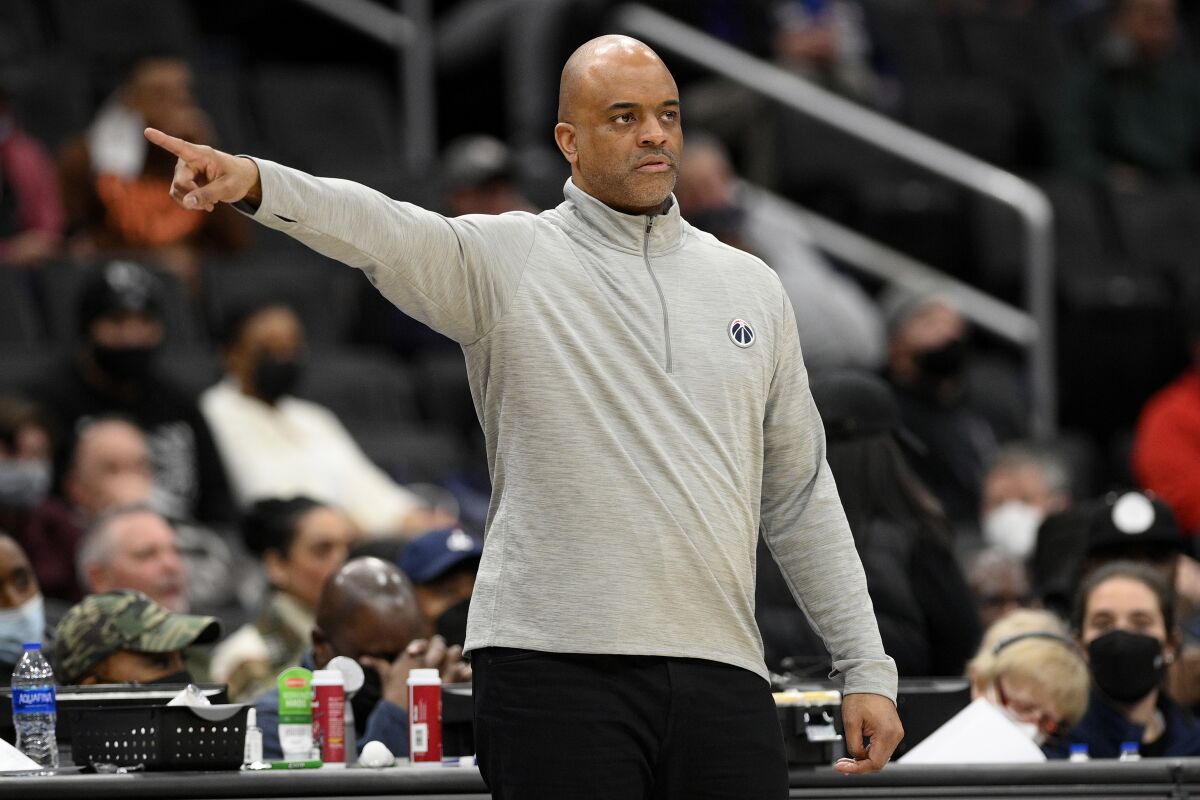 Washington Wizards head coach Wes Unseld Jr. points during the second half of an NBA basketball game against the Orlando Magic, Wednesday, Jan. 12, 2022, in Washington. The Wizards won 112-106. (AP Photo/Nick Wass)