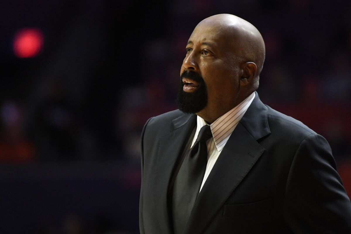 Indiana coach Mike Woodson looks on during the first half of an NCAA college basketball game against Illinois, Thursday, Jan. 19, 2023, in Champaign, Ill. (AP Photo/Michael Allio)