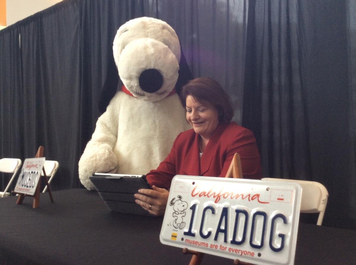 Assemblywoman Toni Atkins (D-San Diego) applies for a Snoopy license plate.