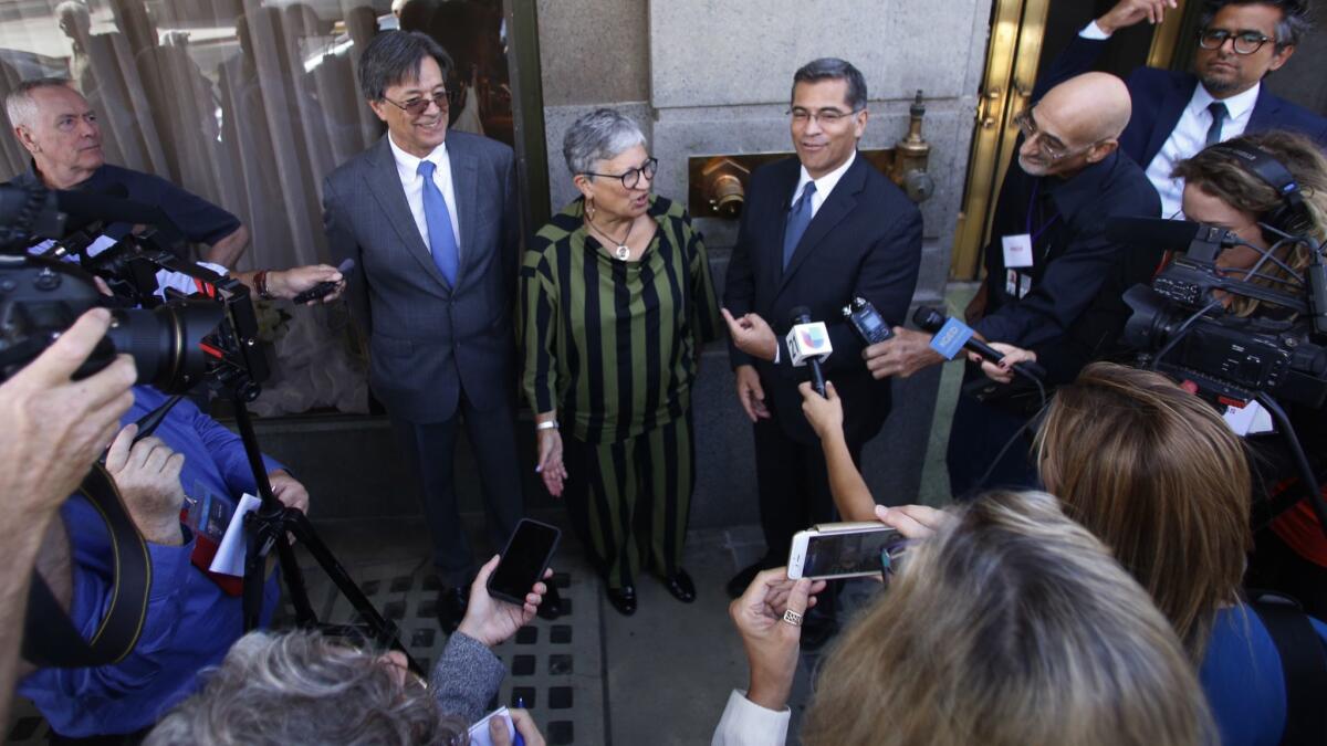 California Air Resources Board Chairwoman Mary Nichols, center, with Cal EPA Secretary Matthew Rodriguez and California Atty. Gen. Xavier Becerra after the first public hearings on the Trump administration's proposal to roll back car-mileage standards.