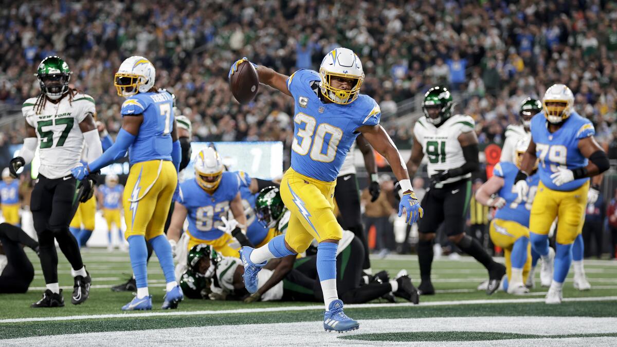 Austin Ekeler spikes the football after running for a Chargers touchdown against the Jets.