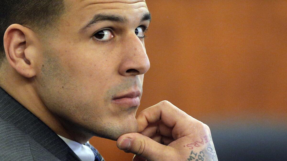 Former New England Patriots tight end Aaron Hernandez listens to testimony during his murder trial in Fall River, Mass., on April 1.