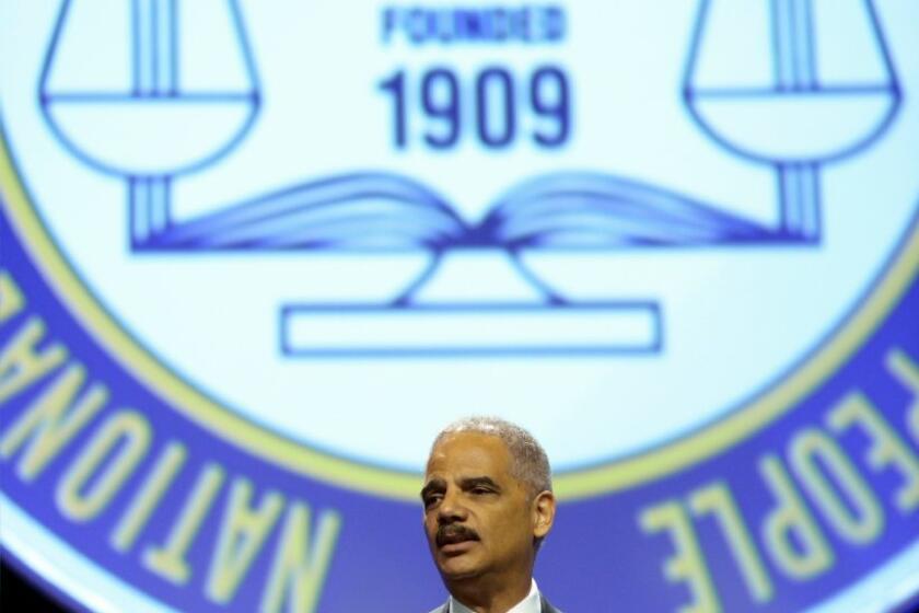 Atty. Gen. Eric H. Holder Jr. speaks to the National Convention of the NAACP on Tuesday in Orlando, Fla. Holder condemned "stand your ground" laws and discussed the George Zimmerman not-guilty verdict in the shooting death of Trayvon Martin.