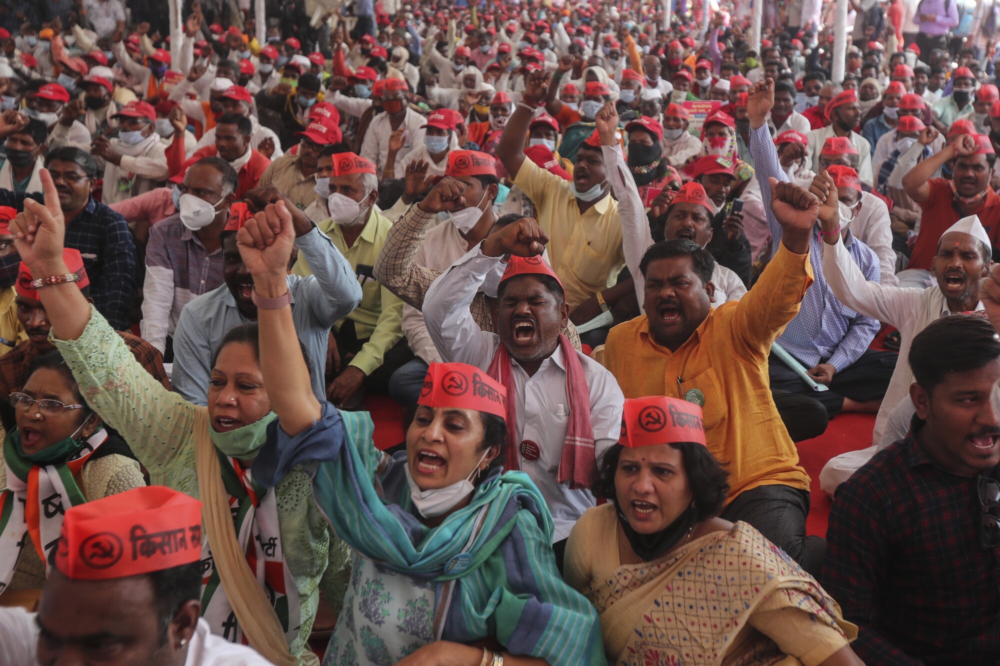 Protesting farmers shout slogans Monday in Mumbai, India