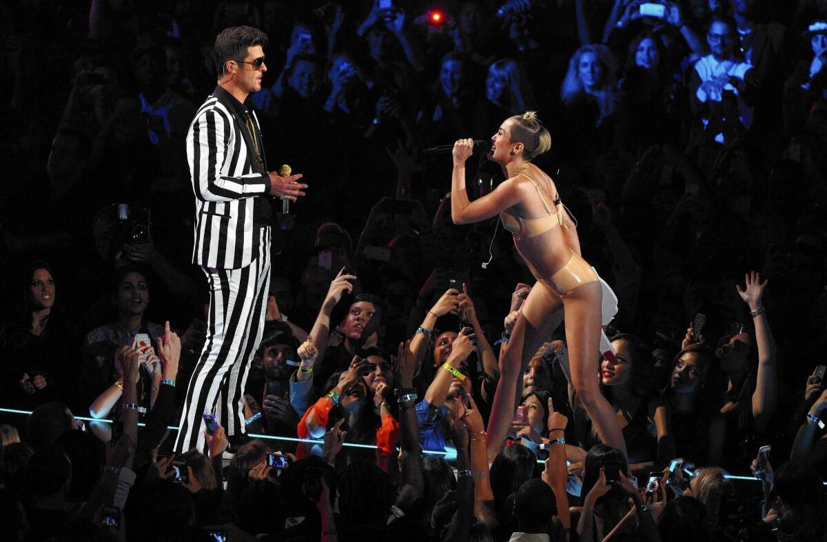 Robin Thicke and Miley Cyrus perform "Blurred Lines" at the MTV Video Music Awards in August.