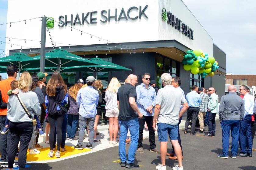 Shake Shack draws a line of hungry customers during grand opening in Costa Mesa Thursday.