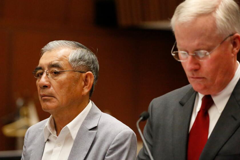 LOS ANGELES, CA â€“ APRIL 11, 2018: Samuel Leung, left, with his lawyer, Daniel V. Nixon, appear in Los Angeles Superior Court for arraignment April 11, 2018. Leung was charged with making illegal campaign donations in connection with an apartment project he was seeking to develop. (Al Seib / Los Angeles Times)