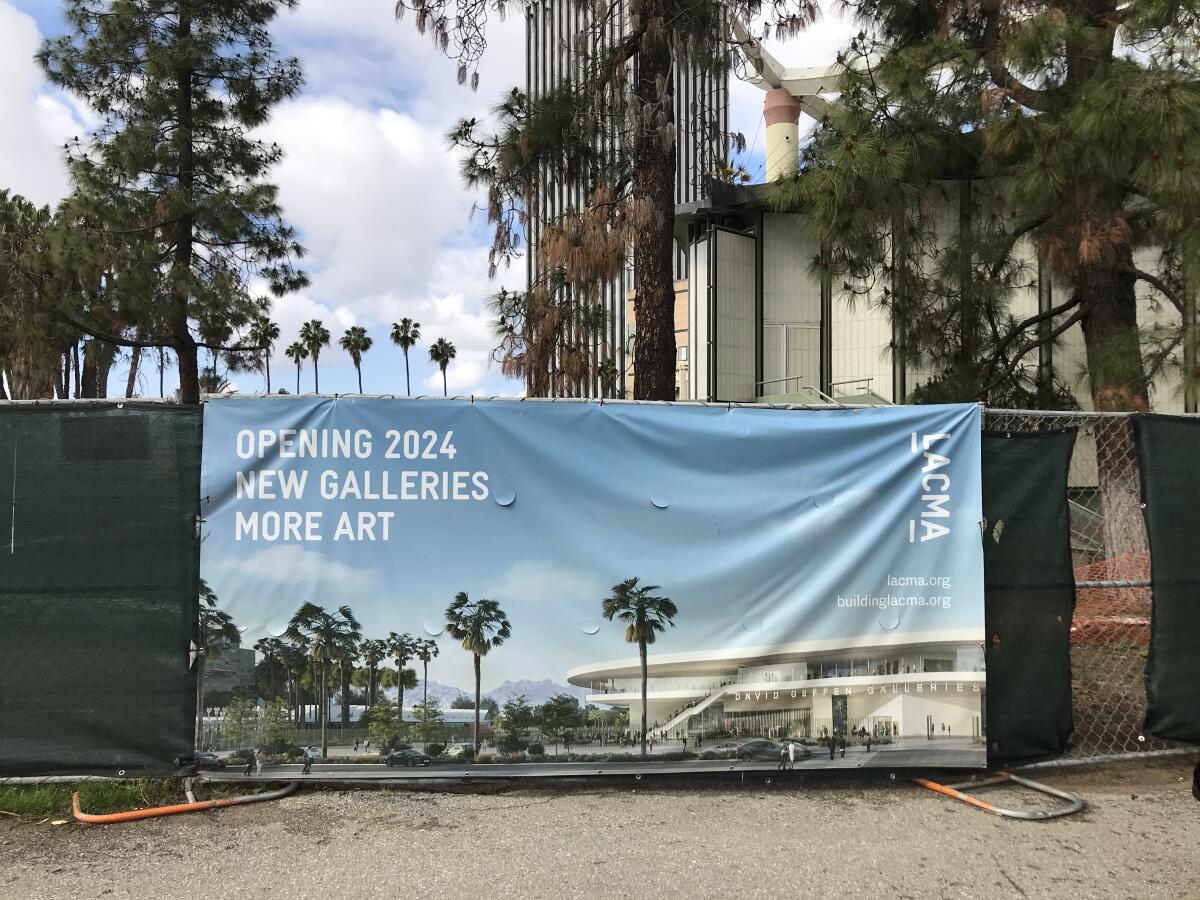 A banner outside of the LACMA demolition zone shows a rendering for the new Peter Zumthor-designed building. It reads "New Galleries, More Art." Demolition of the museum's Bing Theater began on April 6.