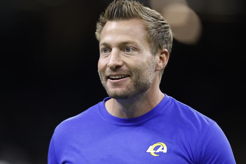 Rams coach Sean McVay watches as players warm up before a game at New Orleans on Nov. 20, 2022.