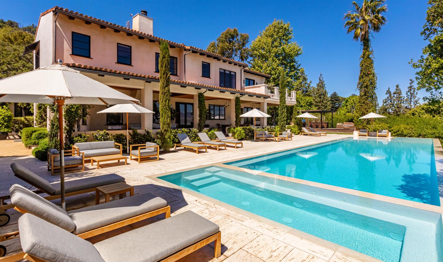The 10-acre spread includes a Spanish-style villa, a guesthouse, guard house, tennis court and two swimming pools.