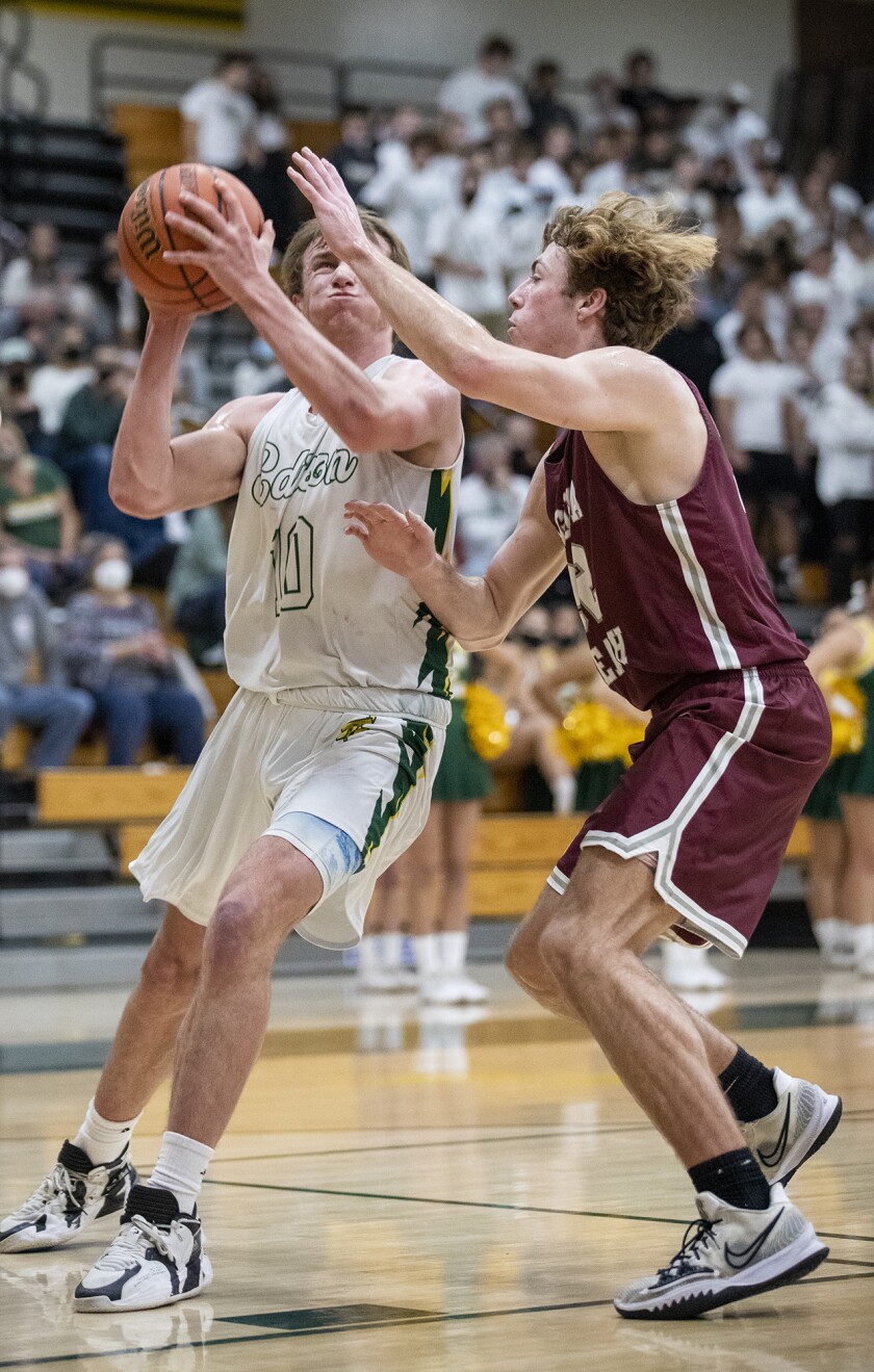 Edison's Tyler Hampton goes up for a shot against Laguna Beach's Jackson Sirianni.