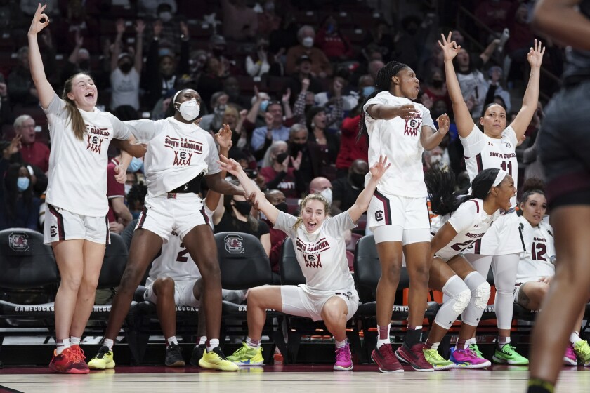 South Carolina players celebrate a three pointer during the second half of an NCAA college basketball game against Texas A&M Thursday, Jan. 13, 2022, in Columbia, S.C. South Carolina won 65-45. (AP Photo/Sean Rayford)