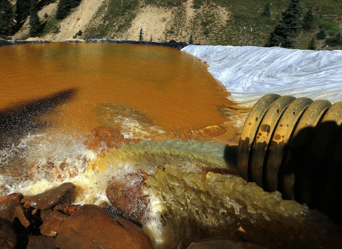 Water flows through a series of retention ponds built to contain and filter out heavy metals and chemicals from the Gold King Mine chemical accident outside Silverton, Colo., on Aug. 14, 2015.