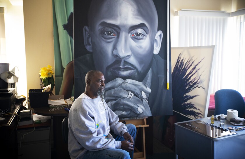 Fulton Leroy Washington, a.k.a. Mr. Wash, in his Compton apartment and painting studio with a Kobe Bryant portait. 