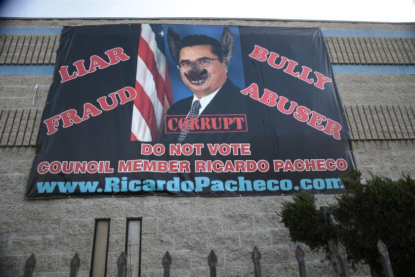 BALDWIN PARK, CA, THURSDAY, JANUARY 16, 2020 - A banner that portrays council member Ricardo Pacheco asa “jackass” hangs from Albert Ehlers business. (Robert Gauthier/Los Angeles Times)