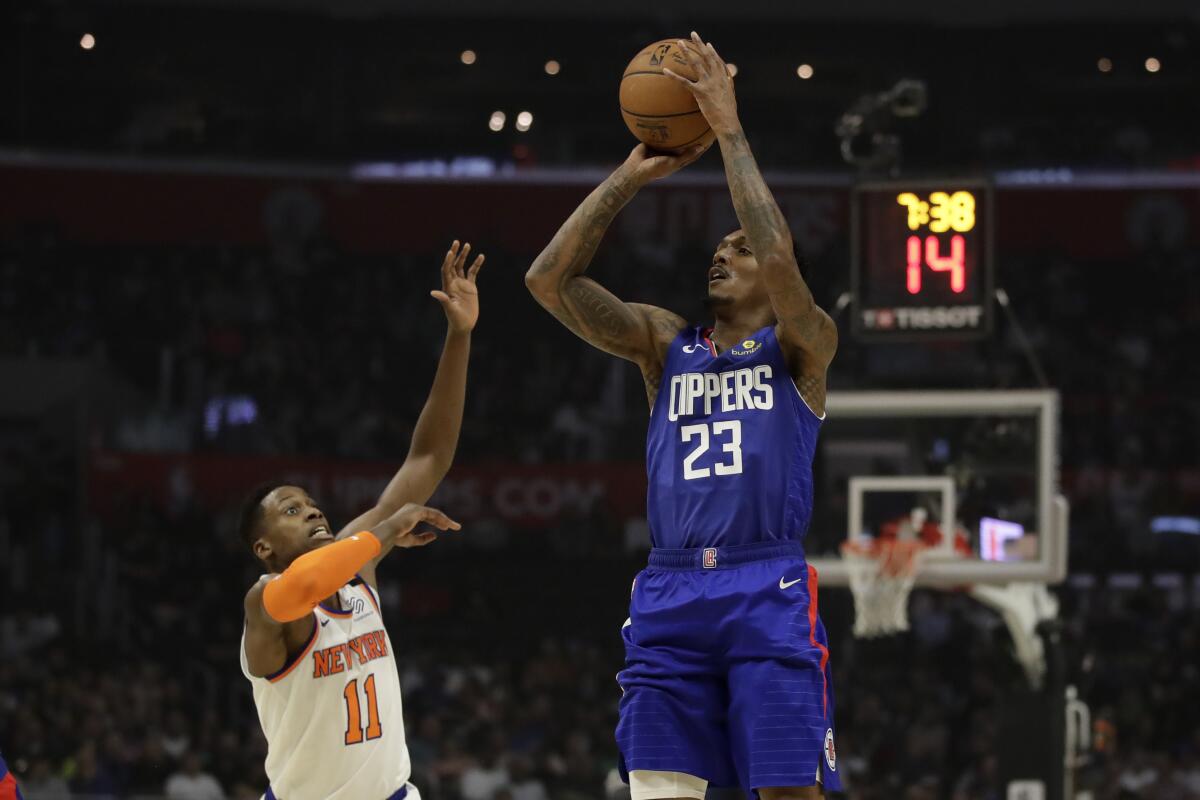 Clippers guard Lou Williams shoots over New York Knicks' Frank Ntilikina on Jan. 5 at Staples Center.