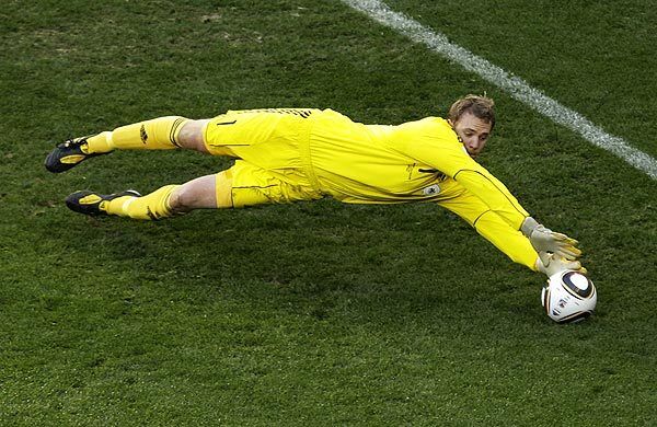 German goalkeeper Manuel Neuer dives to make a save during the quarterfinal soccer match against Argentina. Germany eliminated Argentina from the World Cup.