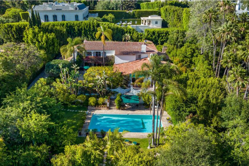 Built in 1934, the Spanish-style mansion maintains its Old Hollywood glamour with crystal chandeliers and ornate fireplaces.