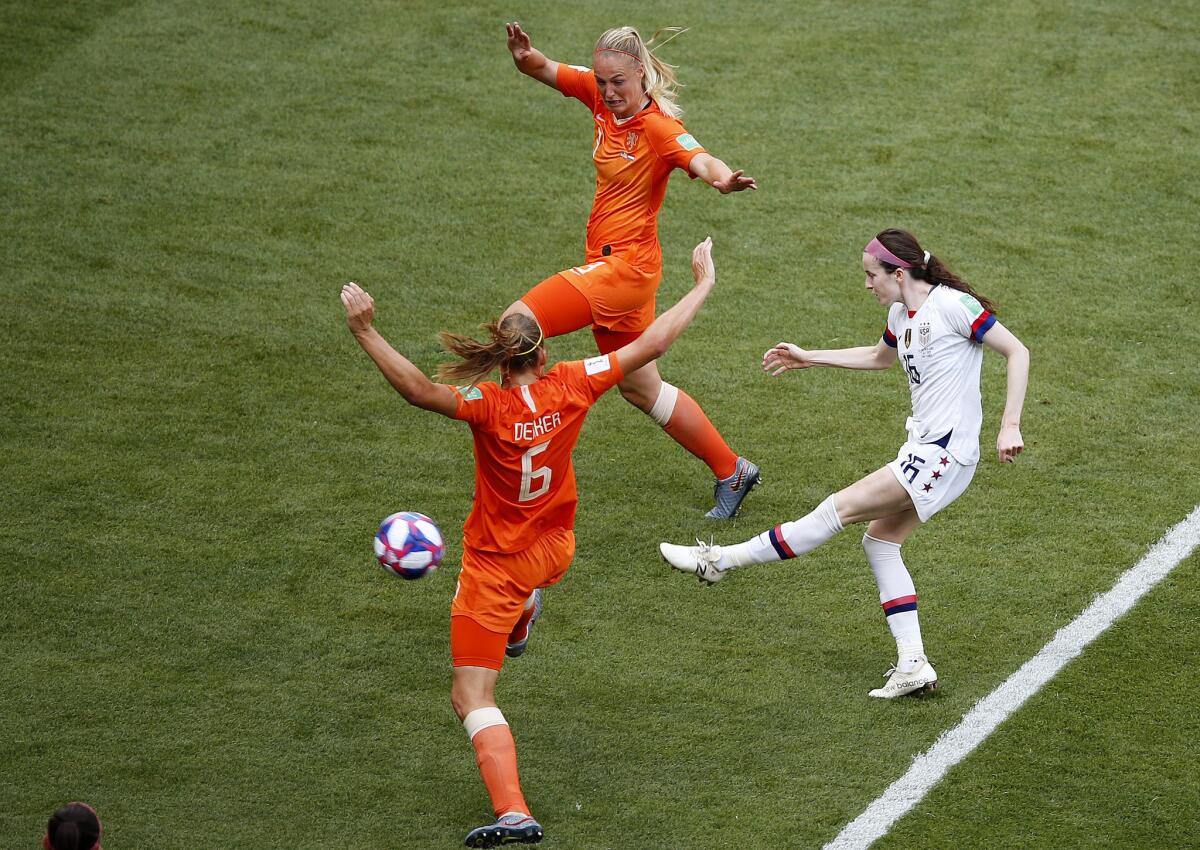 U.S. midfielder Rose Lavelle shoots between two Dutch defenders to score the United States' second goal in the Women's World Cup final on Sunday.