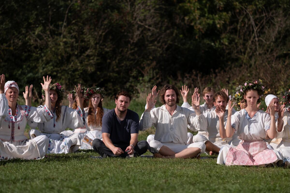 Jack Reynor, center left, and Vilhelm Blomgren, center right, in a scene from "Midsommar."