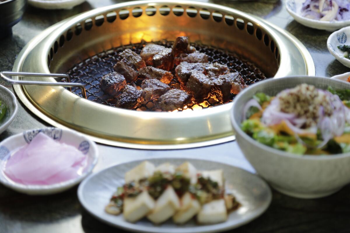 Cut-up rib-eye on the grill at Jeong Yuk Jeom
