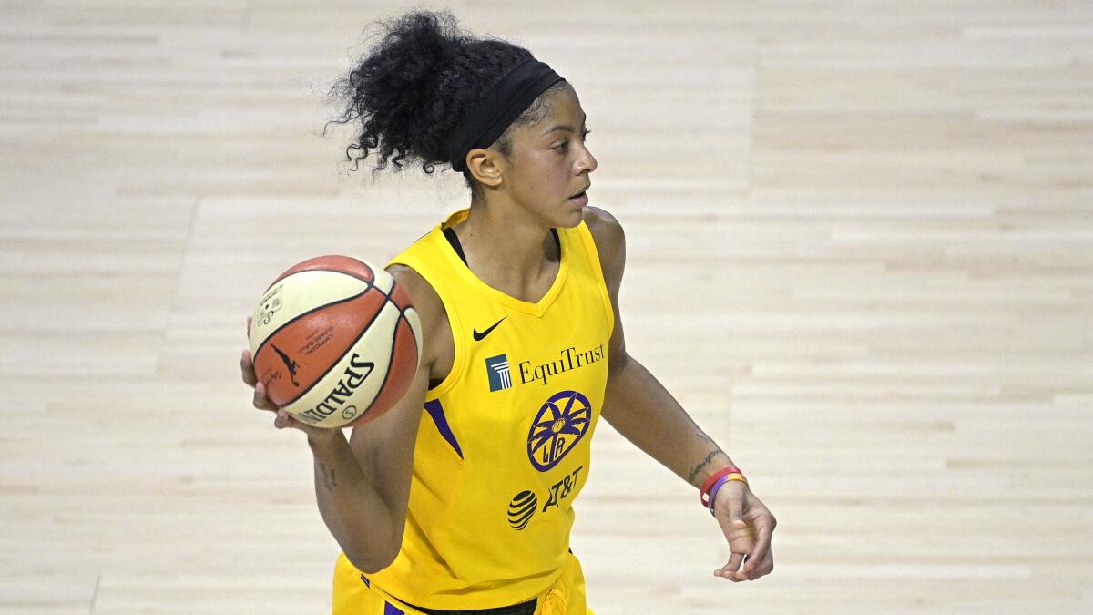 Sparks forward Candace Parker passes the ball.