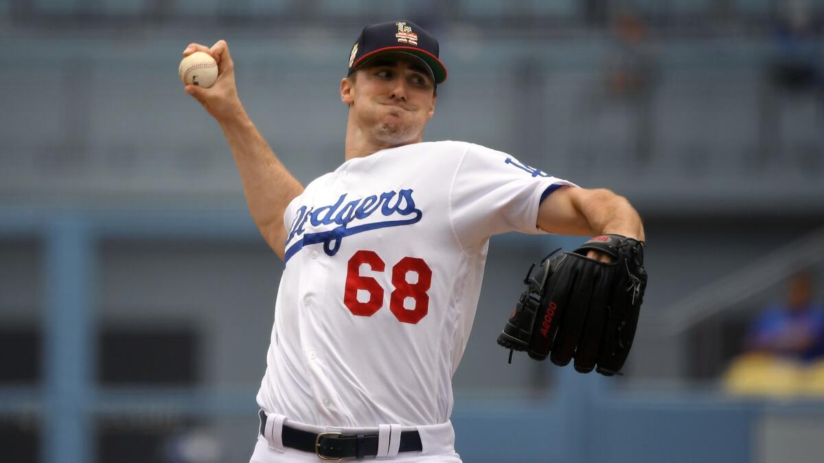 Ross Stripling delivers during the first inning of the Dodgers' 5-3 loss to the San Diego Padres on Sunday.