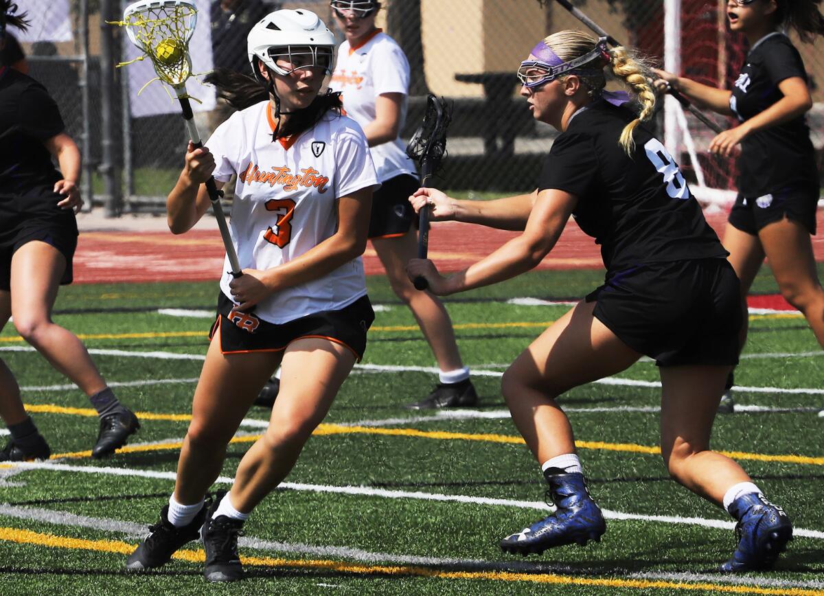 Huntington Beach's Maya Ford (3) attacks the goal against Portola in the CIF Division 3 final on Saturday.