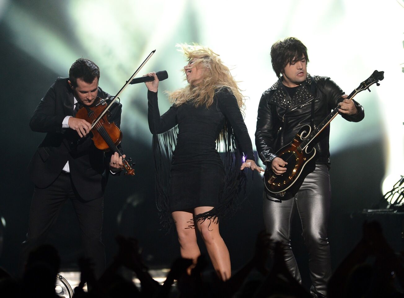 Singer Kimberly Perry, center, and musician Neil Perry, right, of the Band Perry perform onstage during the 2013 Billboard Music Awards.