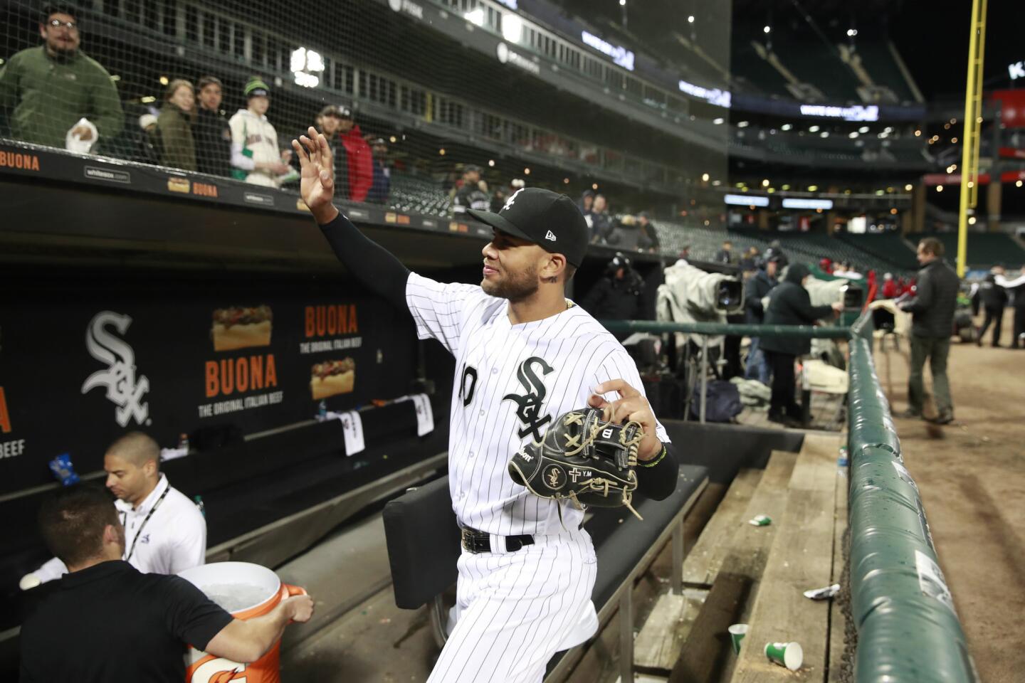 White Sox second baseman Yoan Moncada (10) waves to the fans behind the dugout as he heads for the clubhouse following his team's 10-4 win over the Mariners at Guaranteed Rate Field on Monday, April 23, 2018.