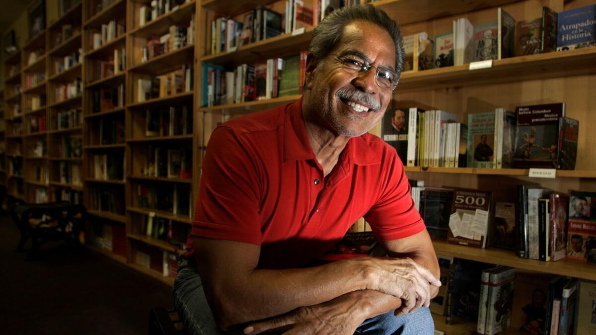 Rueben Martinez, in his bookstore in 2004, started out selling books in Santa Ana his barbershop.