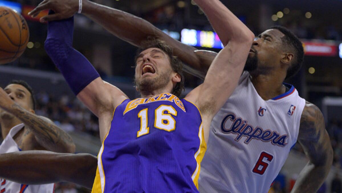 Los Angeles Clippers center DeAndre Jordan, right, blocks a shot by Lakers center Pau Gasol during the Clippers' blowout win on Jan. 10. The Clippers and Lakers renew their rivalry Thursday.