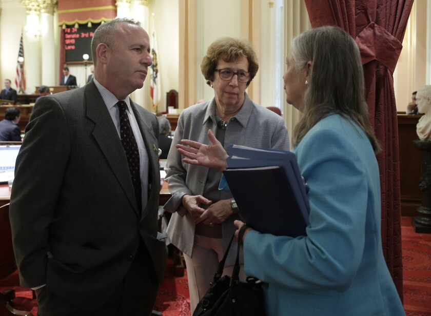 Senators Darrell Steinberg (D-Sacramento), Lois Wolk (D-Davis) and Fran Pavley (D-Agoura Hills) discuss a water bond on the Senate floor last month. On Thursday, Senate Democrats announced a $7.5 billion plan.