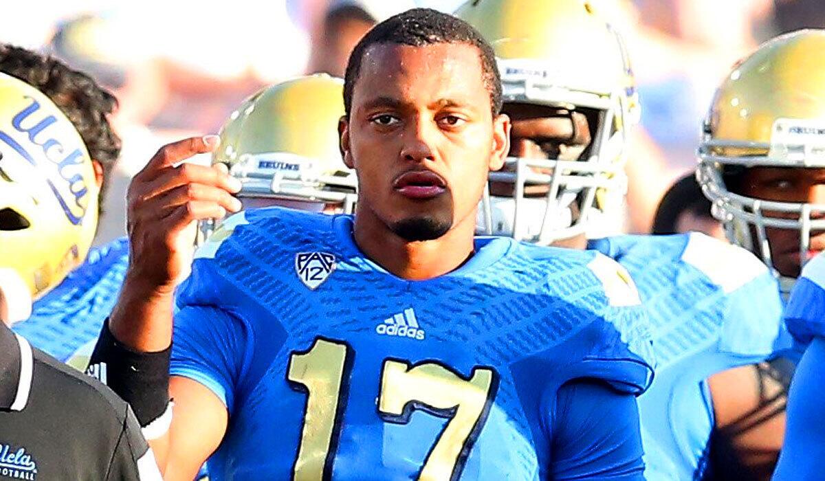 UCLA quarterback Brett Hundley watches from the sideline late in the game against Stanford on Nov. 28.
