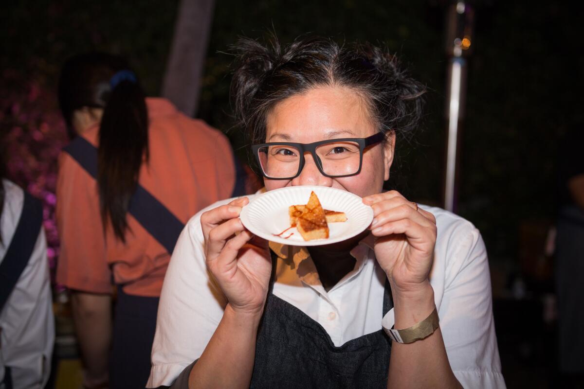 Minh Phan shows off one of her Porridge + Puffs dishes at the 2019 L.A. Times 101 Best Restaurants event.