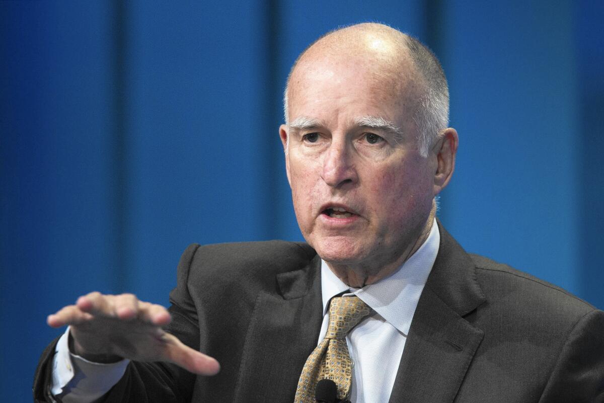 Gov. Jerry Brown talks about new efforts to cope with climate change during a panel discussion in Beverly Hills on April 29.