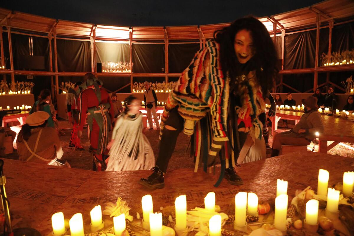 Micaela Tobin as Coyote and members of the Industry perform in "Sweet Land," at Los Angeles State Historic Park on Feb. 21, 2020.