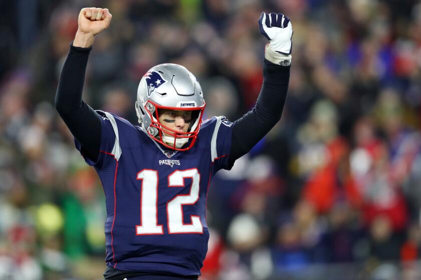 FOXBOROUGH, MASSACHUSETTS - DECEMBER 21: Tom Brady #12 of the New England Patriots celebrates after Rex Burkhead #34 scored a touchdown against the Buffalo Bills in the fourth quarter at Gillette Stadium on December 21, 2019 in Foxborough, Massachusetts. The Patriots defeat the Bills 24-17. (Photo by Maddie Meyer/Getty Images)