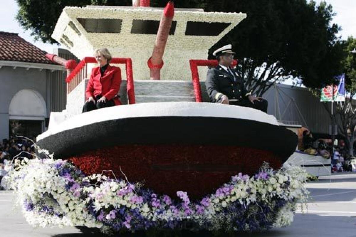 L.A. Councilwoman Janice Hahn and Fire Chief Douglas L. Barry ride aboard a replica of a fire boat -- one of the city's Rose Parade float entries. This year, the city paid tribute to the Port of Los Angeles.