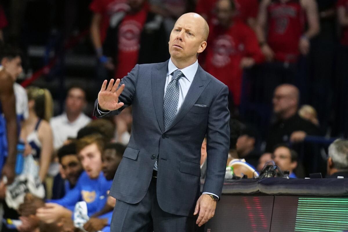 UCLA coach Mick Cronin gestures to his players during the second half against Arizona on Saturday.