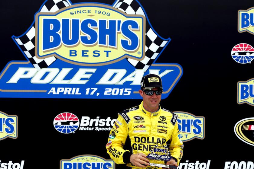 Matt Kenseth poses with the Bush's Best Pole Day award after qualifying for the pole position for the NASCAR Sprint Cup Series Food City 500 at Bristol Motor Speedway on Friday.