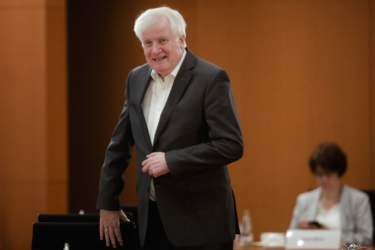German Interior Minister Horst Seehofer arrives for the cabinet meeting at the chancellery in Berlin, Germany, Wednesday, July 29, 2020. Olaf Scholz leads the meeting because German Chancellor Angela Merkel is on vacation. (AP Photo/Markus Schreiber, Pool)