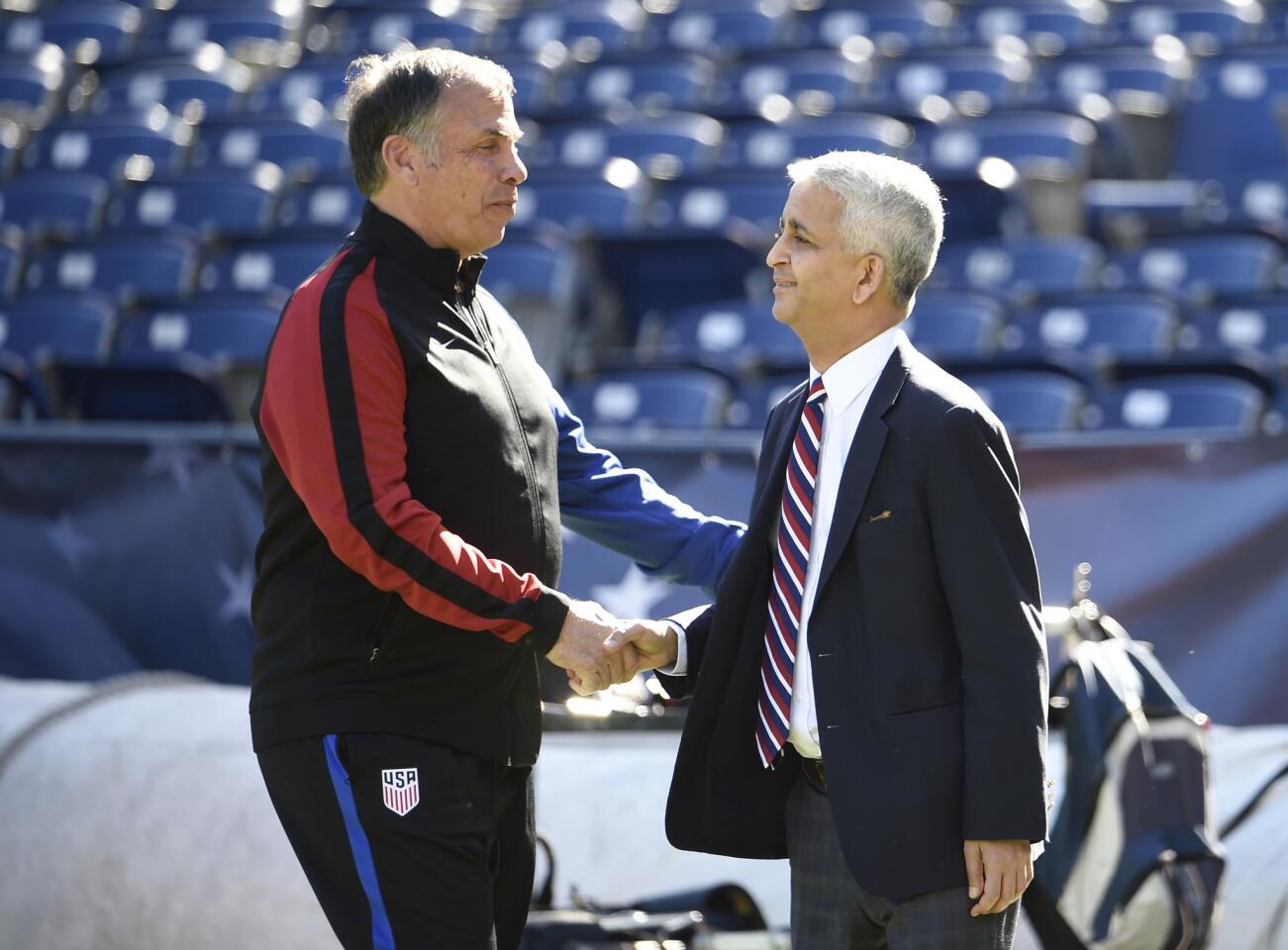 United States head coach Bruce Arena, left, shakes hands with Sunil Galati, President of the U.S. Soccer Federation, before a friendly soccer match against Serbia, Sunday, Jan. 29, 2017 in San Diego. (AP Photo/Denis Poroy)